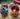 Photo Set mit kleinen bunten Christbaumkugeln aus Holz, die sich öffnen lassen Set mit kleinen bunten Christbaumkugeln aus Holz, die sich öffnen lassen