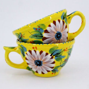 Beautiful ceramic coffee mugs with daisies