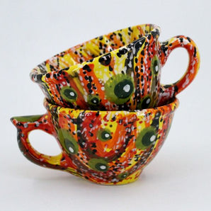 Colorful ceramic teacup with abstraction pattern