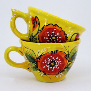 Yellow ceramic mug with poppies