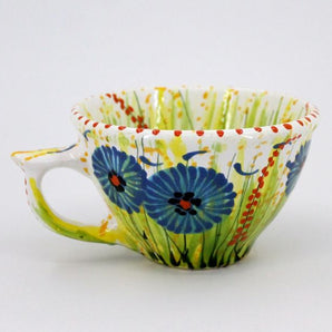 Handmade ceramic teacup with cornflowers