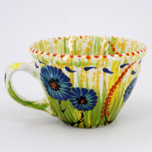 Handmade ceramic teacup with cornflowers