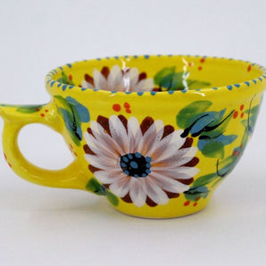 Beautiful ceramic coffee mugs with daisies