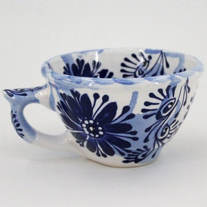 Ceramic mug with blue floral pattern