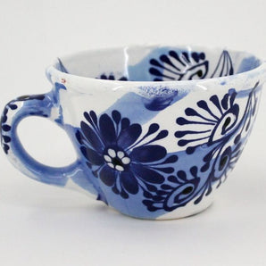 Ceramic mug with blue floral pattern