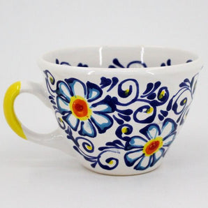 Pottery cup painted with floral pattern