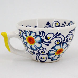 Pottery cup painted with floral pattern