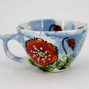 Blue ceramic cup hand painted with poppies