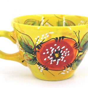 Yellow ceramic mug with poppies