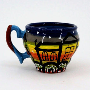 Beautiful ceramic coffee mugs with houses