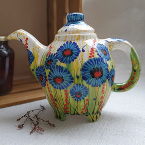 Design clay teapot with cornflowers