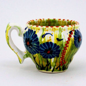 Beautiful ceramic teacup with cornflowers