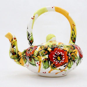 Colorful ceramic teapot with poppies