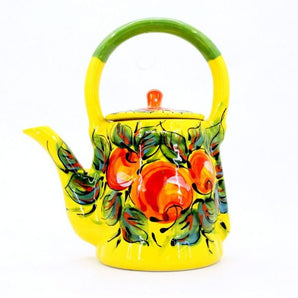 Colorful ceramic teapot with apples