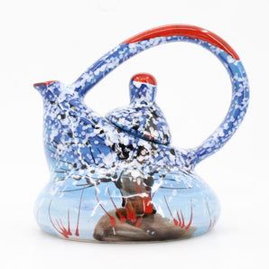 Original ceramic teapot with winter motifs