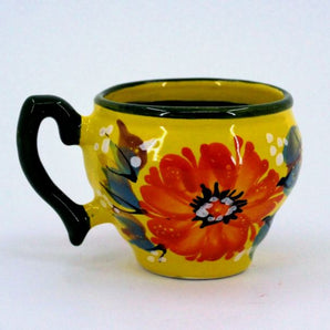 Beautiful ceramic coffee mugs in yellow