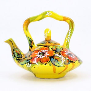 Pottery teapot in yellow with poppies