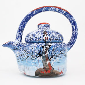 Hand-painted ceramic teapot with winter motif