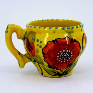 Colorful ceramic cup with poppies