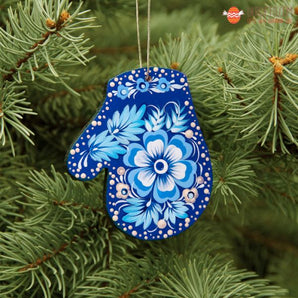 Blue wooden mitten Christmas tree decoration with white floral pattern