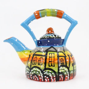 Colorful ceramic teapot with house motifs