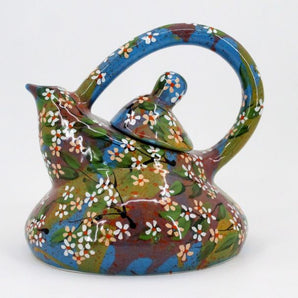 Pottery teapot with small flowers