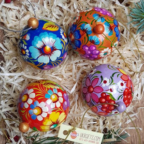 Set of small, colorful wooden Christmas tree balls that can be opened