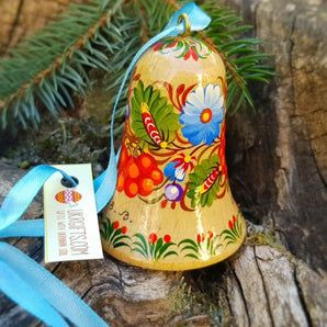 Hand-painted bell with floral pattern made of natural wood