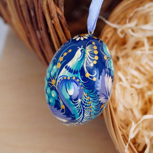 Beautiful wooden Easter egg with fabulous bird, delicate work