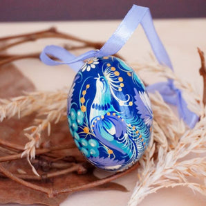 Beautiful wooden Easter egg with fabulous bird, delicate work