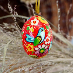 Red wooden Easter hand painted egg, Ukrainian Petrykivka painting