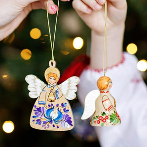 Christmas angel and bell made of wood, white and blue