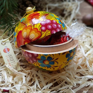 Yellow Christmas ball painted with floral pattern