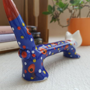 Long cat made of ceramic - a man, without function, simply funny