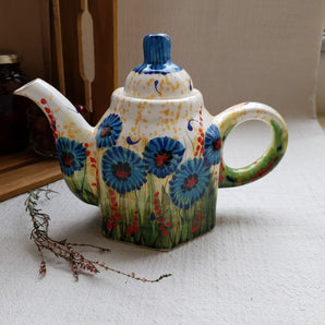 Hand-painted ceramic teapot with cornflowers, traditional handicraft