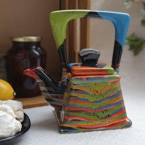 Design clay teapot with abstract painting