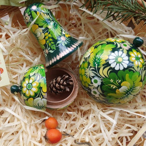 Green hand-painted Christmas balls and bells with floral pattern, traditional handicraft