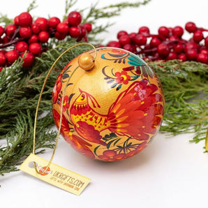 Gold-red Christmas ball artistical hand painted with a bird motif