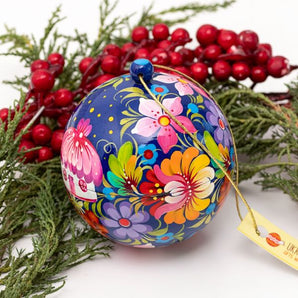 Colorful Christmas ball artistical hand painted with a house as a motif