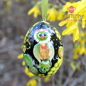 Wooden Easter egg with painted owl, ukrainian pysanka