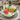 Easter table decoration natural materials - colorful wooden Easter eggs in a basket