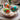 Hand-painted wooden Easter eggs in a basket - Ukrainian handicrafts