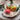 Easter table decoration natural materials - colorful wooden Easter eggs in a basket