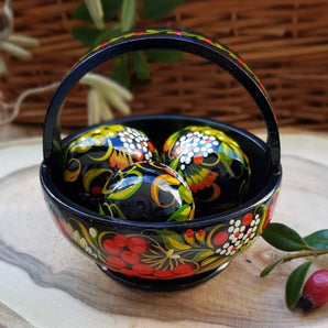 Traditional painted Easter eggs in a small wooden basket