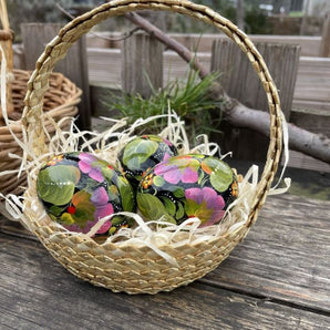 Traditional Ukrainian Easter eggs hand-painted, made of wooden 3 pieces in a basket