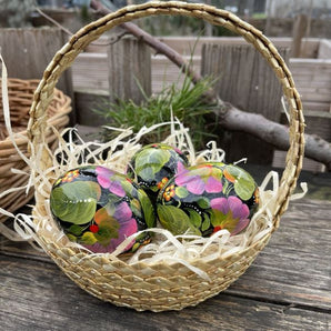 Traditional Ukrainian Easter eggs hand-painted, made of wooden 3 pieces in a basket