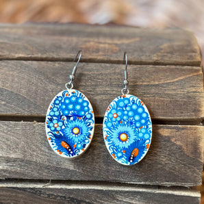 Painted earrings with floral pattern in blue