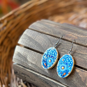 Painted earrings with floral pattern in blue