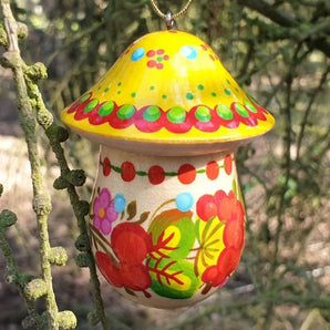 Christmas tree decoration in mushroom shape made of wood, which is hand painted