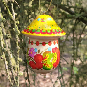 Christmas tree decoration in mushroom shape made of wood, which is hand painted